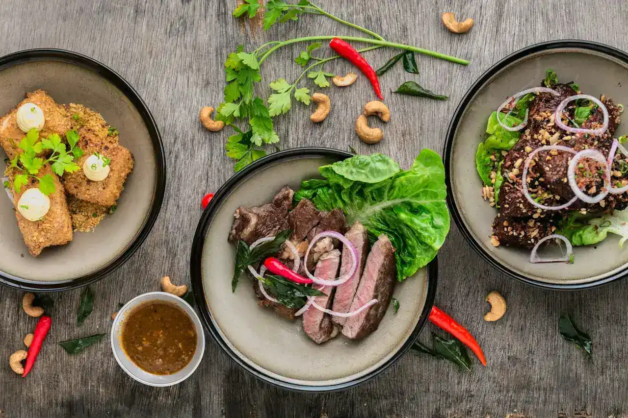 An overhead spread of freshly plated dishes on a table